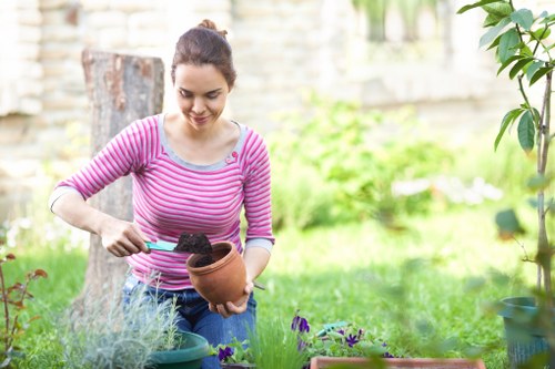 Local Blackwall gardeners handling equipment in a courtyard